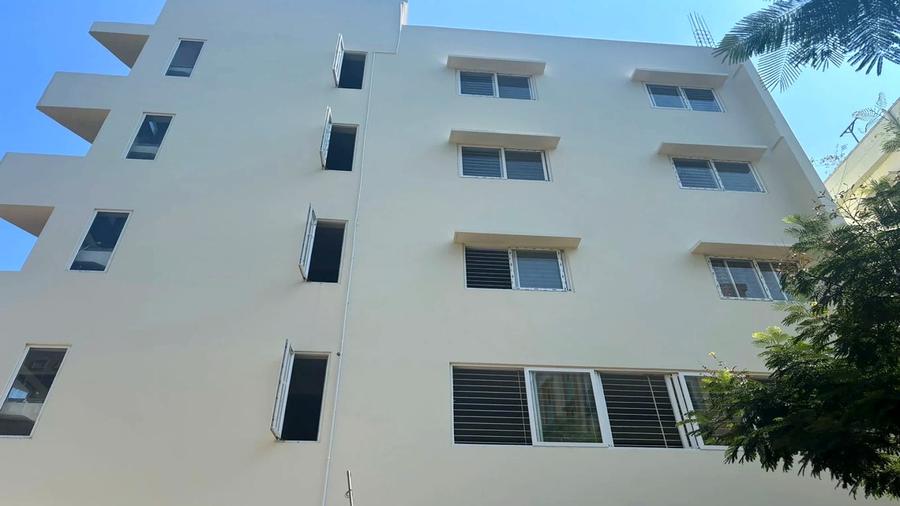 The Nest Girls PG — clean white building exterior