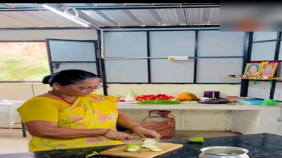 Cook preparing fresh vegetables in the in-house kitchen