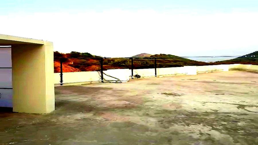 Rooftop terrace with sea and hill view